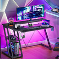Black L‑Shaped Gaming Desk with LED & Power Outlet